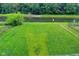 Green backyard with pond views at 10431 Bellchime Ct, Indianapolis, IN 46235