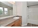 Well-lit bathroom with a large mirror, vanity, and shower/tub combination at 10431 Bellchime Ct, Indianapolis, IN 46235