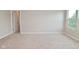Bright bedroom features neutral walls, carpeted floors and a window with views of the outdoors at 10431 Bellchime Ct, Indianapolis, IN 46235