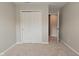 Bedroom with carpet, sliding door closet, and bright lighting that provides a cozy, adaptable space at 10431 Bellchime Ct, Indianapolis, IN 46235