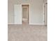 Open view of a bedroom with neutral walls, plush carpeting and ample closet space at 10431 Bellchime Ct, Indianapolis, IN 46235