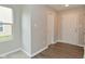 Bright foyer featuring hardwood flooring, with a window letting in natural light, and a closet for storage at 10431 Bellchime Ct, Indianapolis, IN 46235