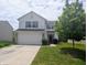 Charming two-story home featuring an attached two-car garage and a well-manicured front lawn at 10431 Bellchime Ct, Indianapolis, IN 46235