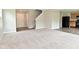 Open concept living room, hardwood flooring and staircase, bright and spacious with natural light at 10431 Bellchime Ct, Indianapolis, IN 46235
