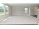 Bright and airy living room boasting multiple windows and neutral tones at 10431 Bellchime Ct, Indianapolis, IN 46235