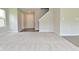 Spacious open-plan living room featuring hardwood flooring, with staircase, bright and spacious at 10431 Bellchime Ct, Indianapolis, IN 46235