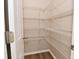 A walk-in pantry with adjustable white wire shelving units on multiple levels, ensuring ample storage space at 10431 Bellchime Ct, Indianapolis, IN 46235
