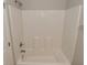 Bright bathroom featuring a white shower and bathtub combination with silver fixtures and faucet at 10431 Bellchime Ct, Indianapolis, IN 46235