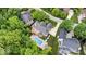 This high angle aerial shows the pool, deck, patio, and landscaping at 11227 Woods Bay Ln, Indianapolis, IN 46236