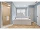 Bathroom with a large soaking tub, separate shower, and neutral finishes at 11227 Woods Bay Ln, Indianapolis, IN 46236