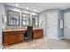 Bathroom featuring double vanities, granite countertops, and wood cabinetry at 11227 Woods Bay Ln, Indianapolis, IN 46236
