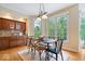 Bright dining room with hardwood floors, large windows, and a view of the outdoors at 11227 Woods Bay Ln, Indianapolis, IN 46236