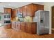 Spacious kitchen with stainless steel appliances, granite countertops, and custom wood cabinets at 11227 Woods Bay Ln, Indianapolis, IN 46236