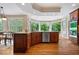 Bright eat-in kitchen with hardwood floors, granite countertops, and stainless steel appliances at 11227 Woods Bay Ln, Indianapolis, IN 46236