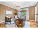 Cozy living room with modern furniture, hardwood floors, and a chandelier at 11227 Woods Bay Ln, Indianapolis, IN 46236