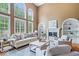 Inviting living area with neutral decor, fireplace, and hardwood flooring at 11227 Woods Bay Ln, Indianapolis, IN 46236