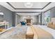 Bright main bedroom with sitting area, fireplace, a chandelier and neutral decor at 11227 Woods Bay Ln, Indianapolis, IN 46236