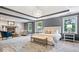 Spacious main bedroom with fireplace, sitting area, large windows, and a chandelier at 11227 Woods Bay Ln, Indianapolis, IN 46236