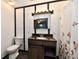 Cozy bathroom with granite countertop, wood vanity, and decorative floral shower curtain at 11309 N County Road 750 W, Elwood, IN 46036