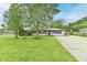 Charming single-story home featuring a well-manicured front lawn and mature shade trees at 11309 N County Road 750 W, Elwood, IN 46036