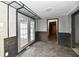 Hallway featuring gray walls, wood accents, and French doors at 11309 N County Road 750 W, Elwood, IN 46036