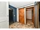 Hallway featuring wood look flooring and a barn door separating spaces at 11309 N County Road 750 W, Elwood, IN 46036