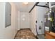 Utility room featuring a water heater, electrical panel, and tile floors at 11309 N County Road 750 W, Elwood, IN 46036