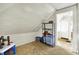 An attic has shelving and a view into the adjoining hall at 1138 N Oxford St, Indianapolis, IN 46201