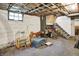 Basement features concrete floor, utility access, and stairs to other level, offering versatile space at 1138 N Oxford St, Indianapolis, IN 46201