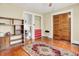 Bedroom with hardwood floors, built-in storage, and a spacious layout. Ready for personalization at 1138 N Oxford St, Indianapolis, IN 46201