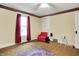 Vintage bedroom with a red arm chair, and vintage carpets at 1138 N Oxford St, Indianapolis, IN 46201