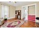 Bedroom with hardwood floors, a cozy chair, and built-in storage at 1138 N Oxford St, Indianapolis, IN 46201