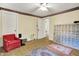 Bright bedroom with a comfortable chair, and vintage carpets at 1138 N Oxford St, Indianapolis, IN 46201