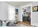 Bright bedroom with an adjacent closet space and a decorative world artifact poster at 1138 N Oxford St, Indianapolis, IN 46201
