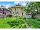 Backyard view of house with a shed and lawn, offering a private outdoor space at 1138 N Oxford St, Indianapolis, IN 46201