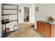 Hallway with wooden cabinet and metal shelving at 1138 N Oxford St, Indianapolis, IN 46201