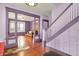 Spacious living room with hardwood floors, decorative columns, and large windows that provide ample natural light at 1138 N Oxford St, Indianapolis, IN 46201