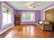 Inviting living room with hardwood floors, a ceiling fan, and plenty of natural light, creating a warm and welcoming space at 1138 N Oxford St, Indianapolis, IN 46201