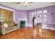 Open-concept living room with hardwood floors, a fireplace, and seamless transition to other living areas, creating a connected space at 1138 N Oxford St, Indianapolis, IN 46201