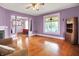 Bright living room boasts a stained glass window, hardwood floors, and natural light at 1138 N Oxford St, Indianapolis, IN 46201