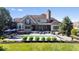 Inviting backyard with a sparkling pool, comfortable seating, and a covered patio at 11404 Hanbury Manor Blvd, Noblesville, IN 46060