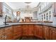 Custom bar area showcasing wood cabinetry and bar counter at 11404 Hanbury Manor Blvd, Noblesville, IN 46060