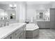 Luxurious bathroom with dual vanities and large soaking tub at 11404 Hanbury Manor Blvd, Noblesville, IN 46060