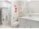 Bright bathroom boasts a white vanity with marble countertop and tiled floor at 11404 Hanbury Manor Blvd, Noblesville, IN 46060