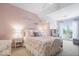 Comfortable bedroom with ample natural light coming in from the french doors at 11404 Hanbury Manor Blvd, Noblesville, IN 46060
