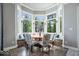 Cozy breakfast nook surrounded by windows, offering ample natural light and scenic views at 11404 Hanbury Manor Blvd, Noblesville, IN 46060
