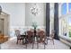 Formal dining room with a chandelier, large windows, and elegant table setting at 11404 Hanbury Manor Blvd, Noblesville, IN 46060