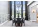 Elegant dining room with a chandelier, tall windows and elegant furnishings at 11404 Hanbury Manor Blvd, Noblesville, IN 46060