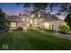 Beautiful two-story home showcasing manicured lawn and landscape at dusk at 11404 Hanbury Manor Blvd, Noblesville, IN 46060
