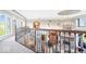 Grand foyer featuring detailed wrought iron railing overlooking a spacious living area at 11404 Hanbury Manor Blvd, Noblesville, IN 46060